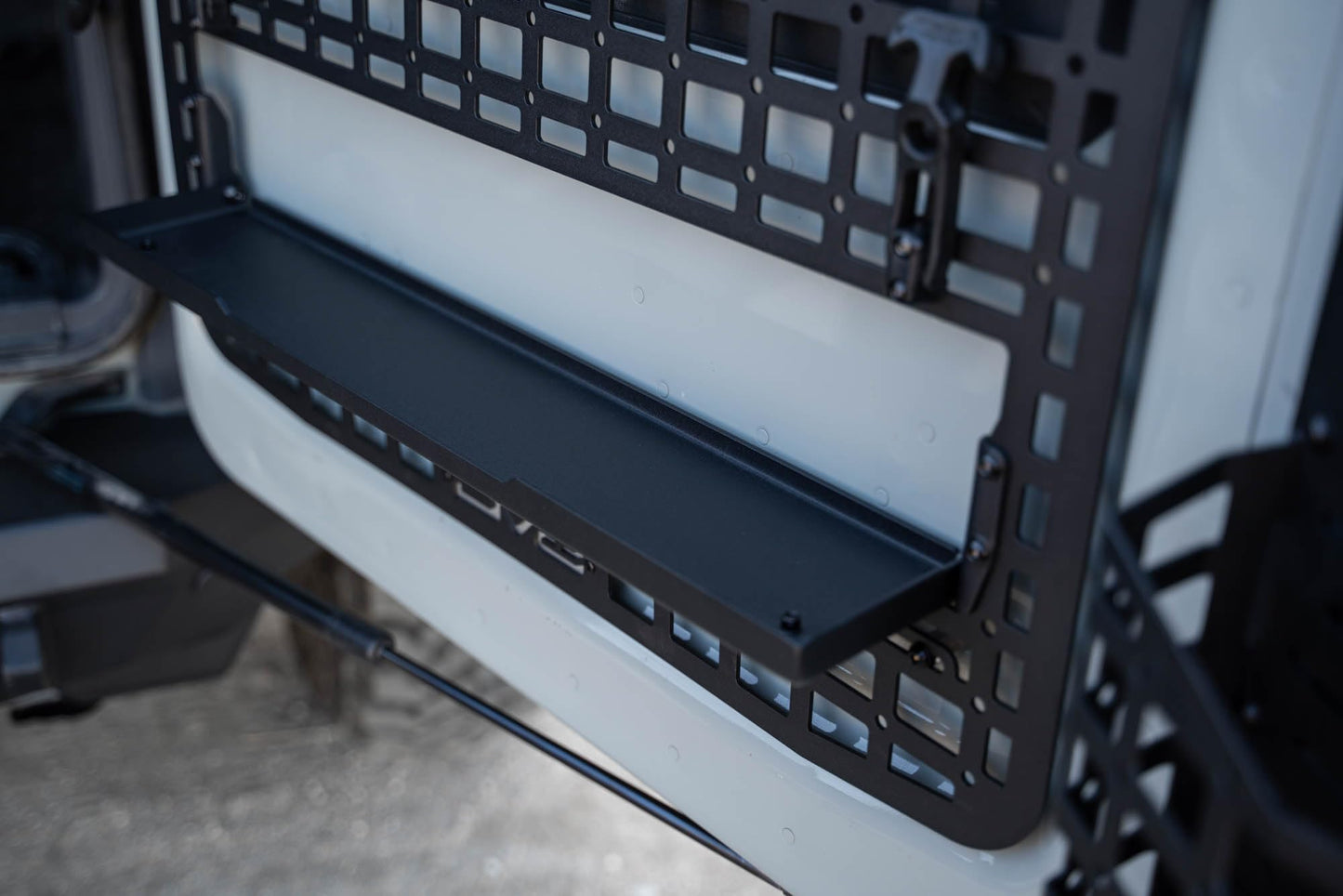 DV8 Offroad Tailgate Molle Panel for The 2021-2026 Ford Bronco | Perfect for Molle Bags, Knife Sheaths, Med Kits, Recovery Gear & More | Drop-Down Tray for Holding Drinks & Other Gear While at Camp