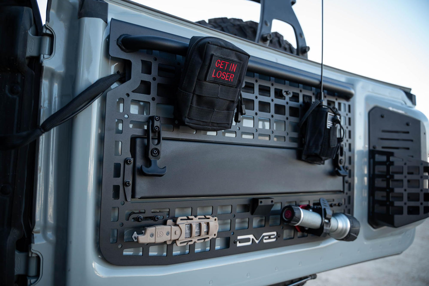 DV8 Offroad Tailgate Molle Panel for The 2021-2026 Ford Bronco | Perfect for Molle Bags, Knife Sheaths, Med Kits, Recovery Gear & More | Drop-Down Tray for Holding Drinks & Other Gear While at Camp