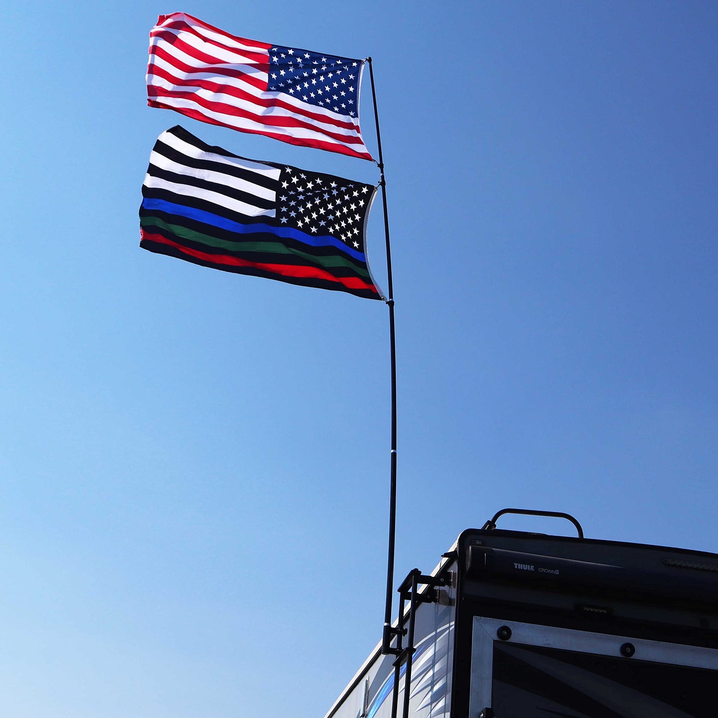 The Traveler Two Flag RV Ladder Flag Pole Kit. Includes Two Beautiful 3’x5’ Flags, Steel RV Flag pole Mount, Fits Standard 1” RV Ladders,14ft Fiberglass Retractable Pole, And A Storage Bag.