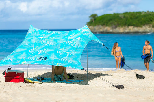 Neso Portable Beach Tent Sun Shelter with Sand Anchor - Lightweight Beach Shade Canopy - Easy Setup for Family Outings - Patented Reinforced Corners - UPF 50+ Sun Protection - 7 x 7ft - Aqua Fronds
